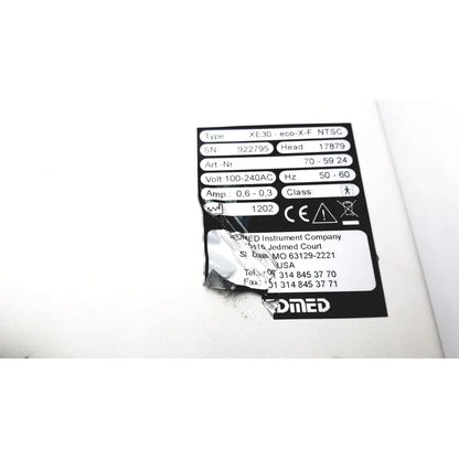 Black and white label on the back side of globalmed innovative telemedicine xe30-eco-x-f ntsc light source device