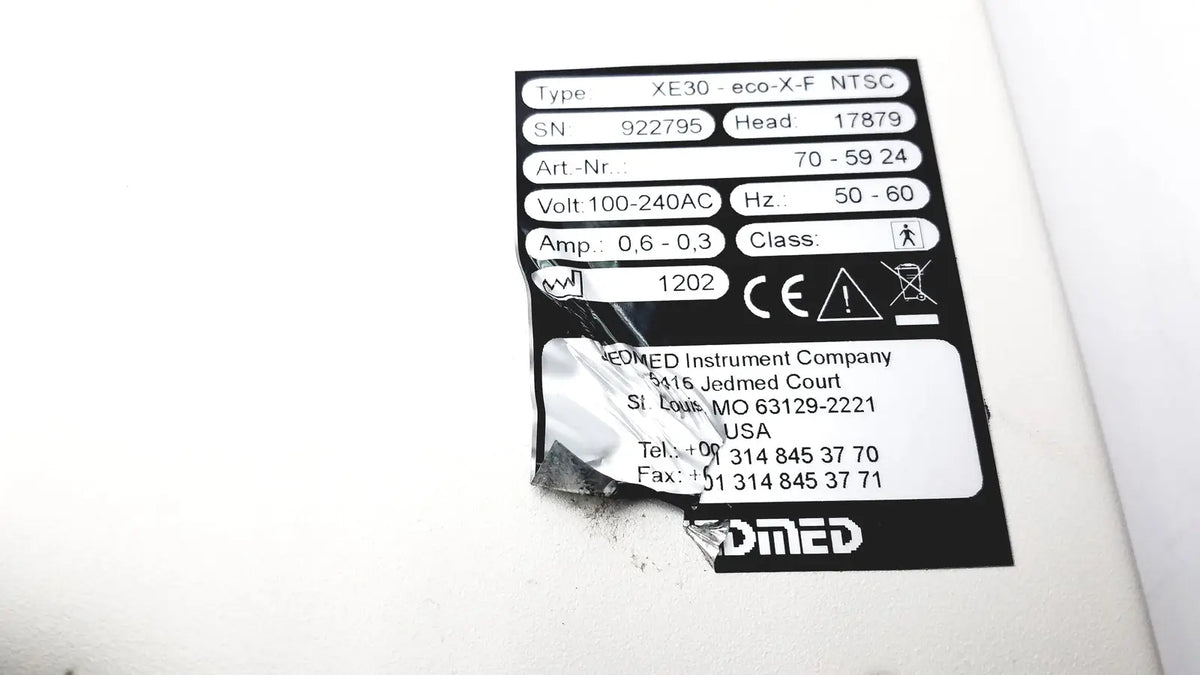 Black and white label on the back side of globalmed innovative telemedicine xe30-eco-x-f ntsc light source device
