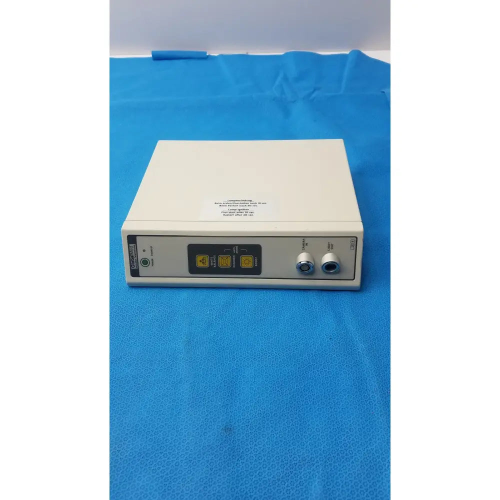 White rectangular surgical electrosurgical unit with yellow buttons and silver ports in globalmed jedmed xe30-eco model