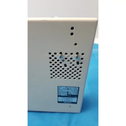 Off-white rectangular electronic device with perforated ventilation panel and label on the back side of globalmed jedmed xe30-eco