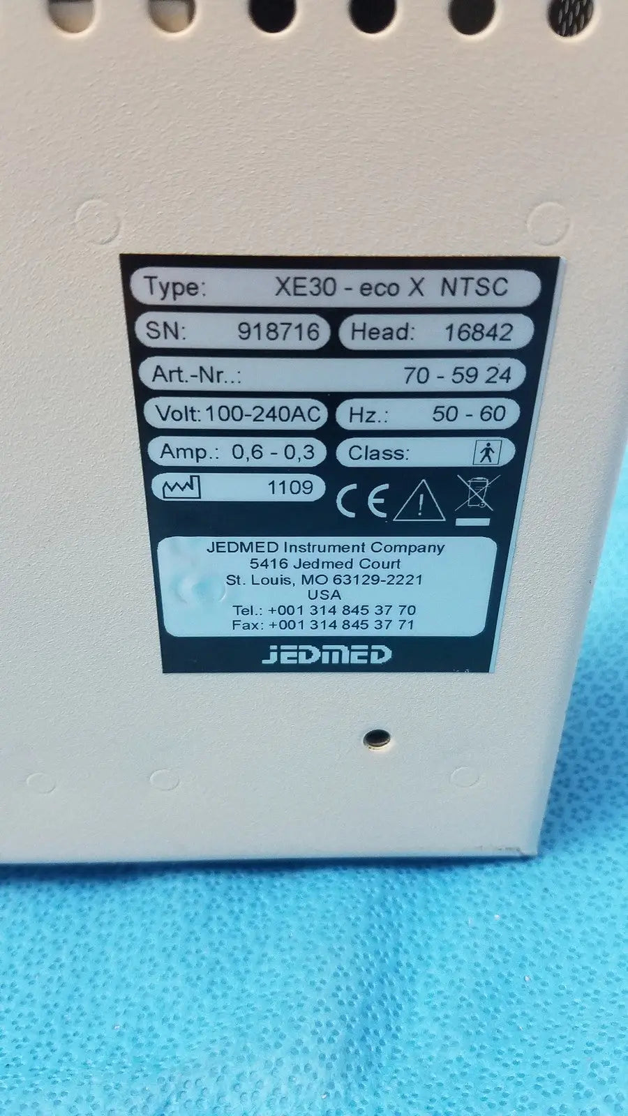 White plastic industrial power supply unit with black label for specifications of globalmed jedmed xe30-eco ntsc model
