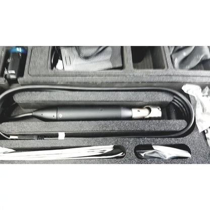 Black cylindrical endoscope with metallic joint and coiled cable in foam case from globalmed telemedicine kit riester