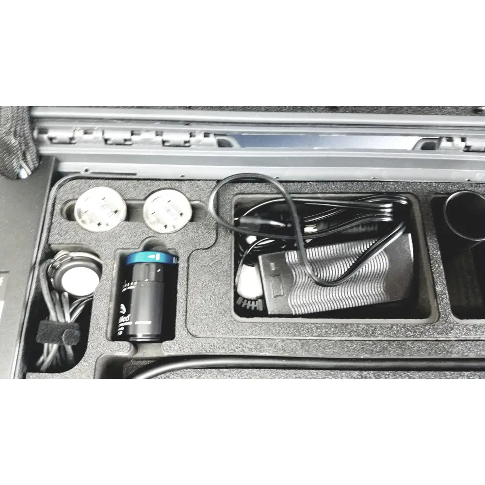 Black cylindrical battery with blue top and white labeling for globalmed telemedicine kit riester otoscope ophthalmoscope use