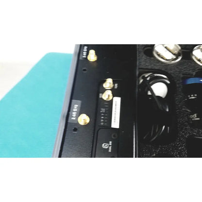 Back side of a black matte dual sim device with gold antenna connectors in the globalmed telemedicine kit riester