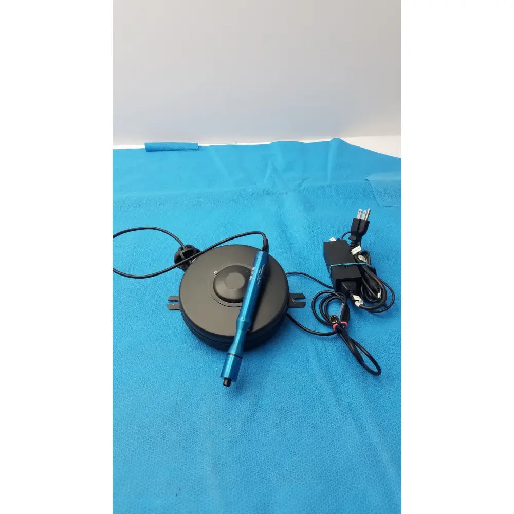 Blue cylindrical examination camera with black base and attached cables for globalmedia totalexam s-video use