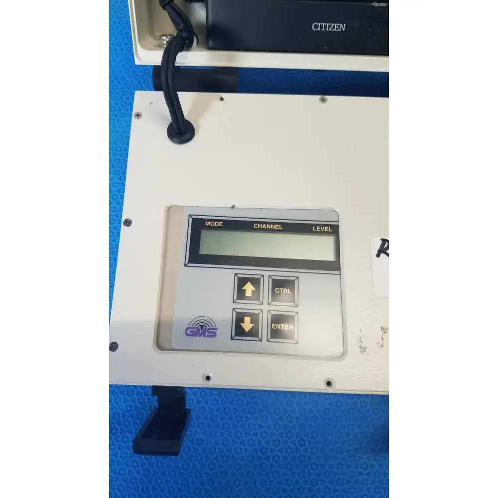 White plastic control panel with gray digital display and black buttons on gms general microwave c f band receiver monitor