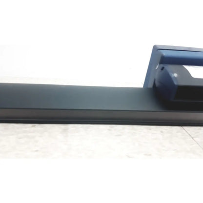 Dark gray plastic window sill with blue device mounted at right end of gn otometrics lb-200 portable light bar