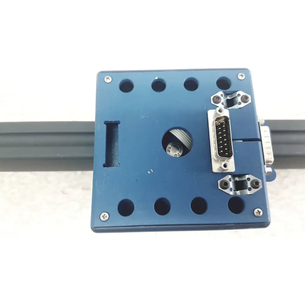 Blue rectangular metal GN Otometrics LB-200 portable light bar with central opening, silver D-sub connector, and mounting brackets