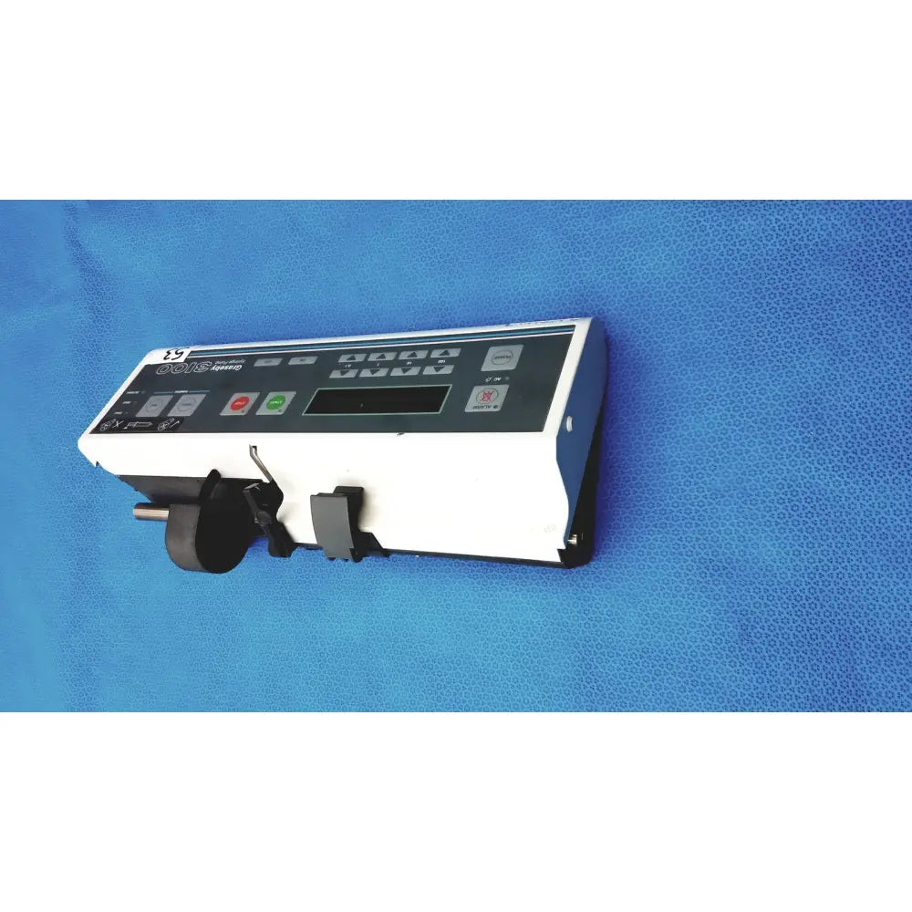 Graseby 3100 syringe delivery device clean medical unit with white and black infusion pump and mechanical clamp