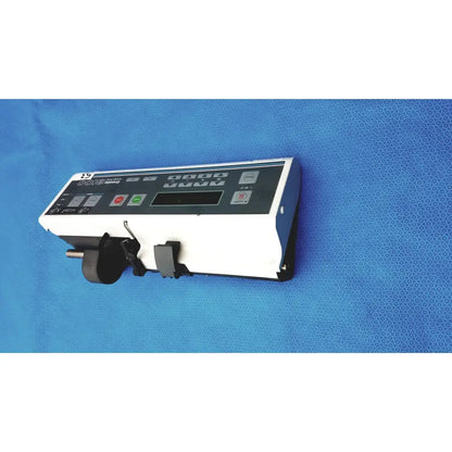 Graseby 3100 syringe delivery device clean medical unit with white and black infusion pump and mechanical clamp