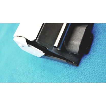 Black and white Graseby 3100 syringe delivery device clean with a metallic cylindrical component for medical use