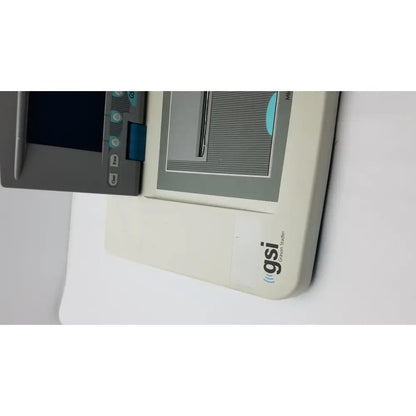 Beige grason stadler gsi tympstar middle ear analyzer with gray control panel and blue buttons for medical use