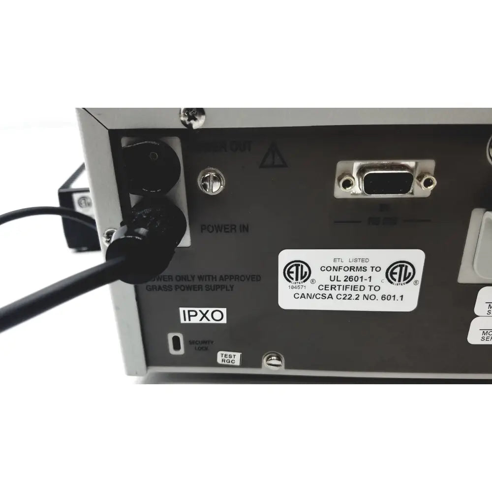 Back side of silver metallic grass 15lt physiodata amplifier system with black power input and db9 serial port labels