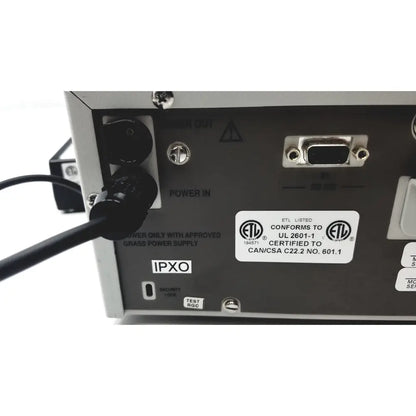Back side of silver metallic grass 15lt physiodata amplifier system with black power input and db9 serial port labels