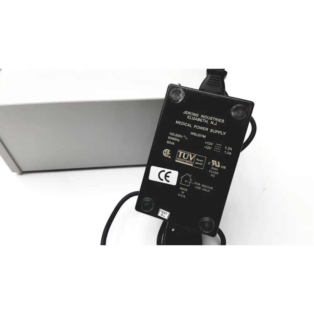 Black rectangular medical power supply adapter with specifications labels on the back for grass 15lt physiodata amplifier system