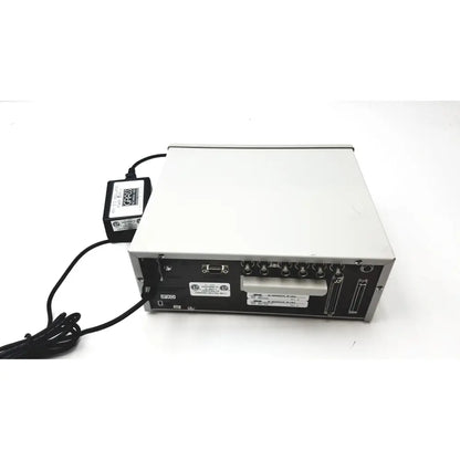 Silver and black grass 15lt physiodata amplifier system with multiple ports and connected power supply at the back side