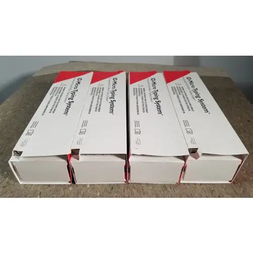 Four white and red boxes of grifols cards dental impression system including racks dilution trays and evaporation caps for reuse medical