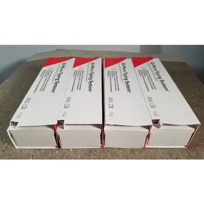 Four white and red boxes of grifols cards dental impression system including racks dilution trays and evaporation caps for reuse medical
