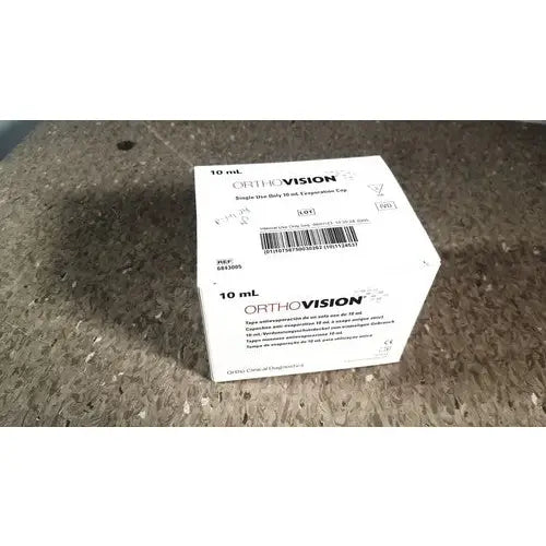 White cardboard orthovision box containing a single-use 10 ml expander cap for grifols cards and dilution trays reuse medical