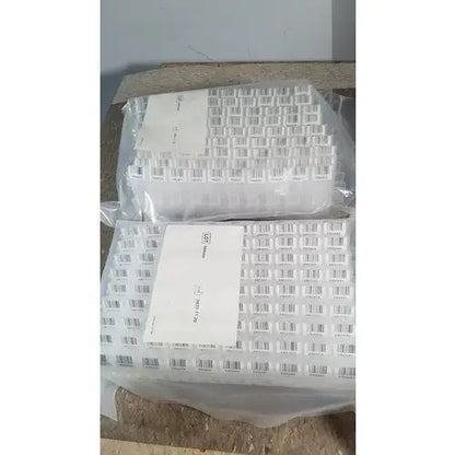White plastic grifols cards storage containers with barcode labels packaged in clear bags for dilution trays evaporation caps