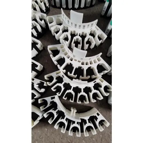 White plastic gutter seal strips with black rubber inserts for grifols cards and dilution trays reuse medical applications