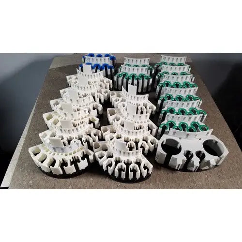 White and black plastic modular connector assemblies for grifols cards and dilution trays promoting reuse medical solutions