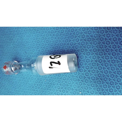 Clear glass vial with white label number 128 and red-tipped stopper used with ground glass cone rubber tubing connector lab joint