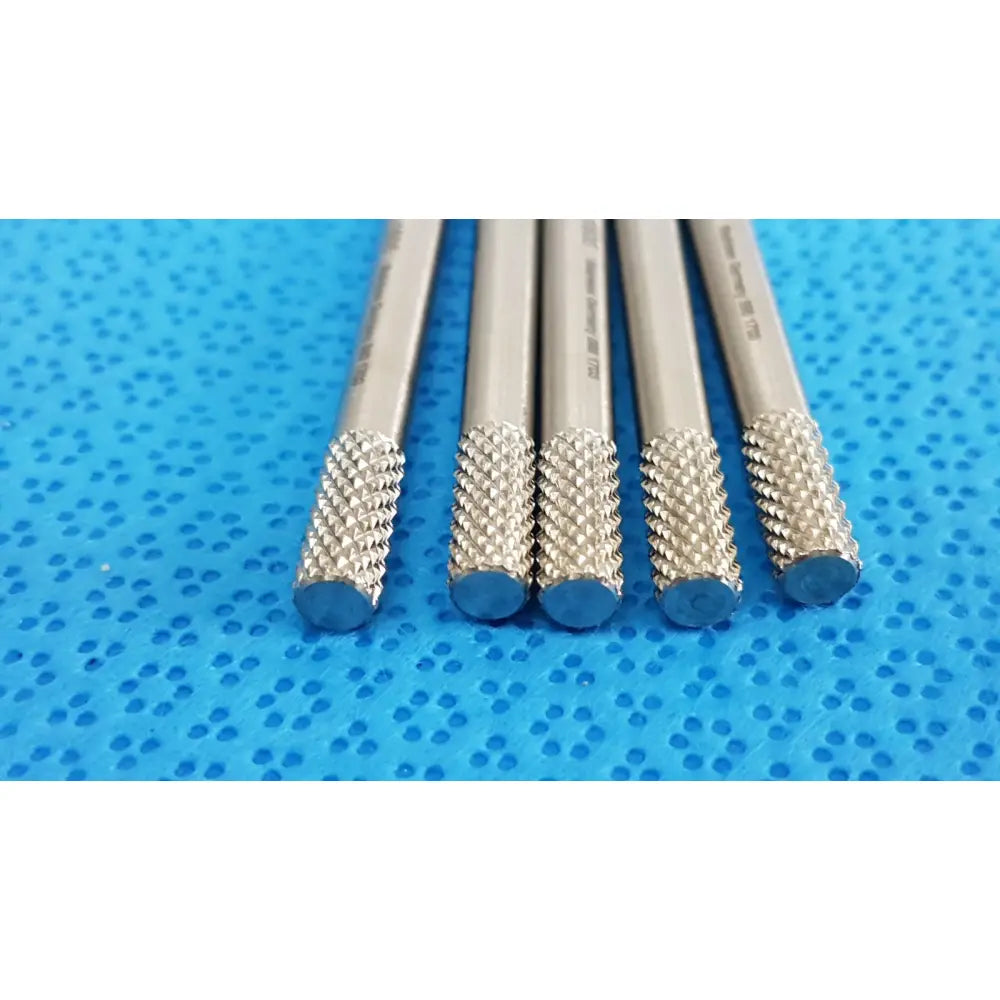 Five silver metal drill bits with knurled tips and blue ends for gs 12.1605 beaver-style scalpel handle precision surgical use