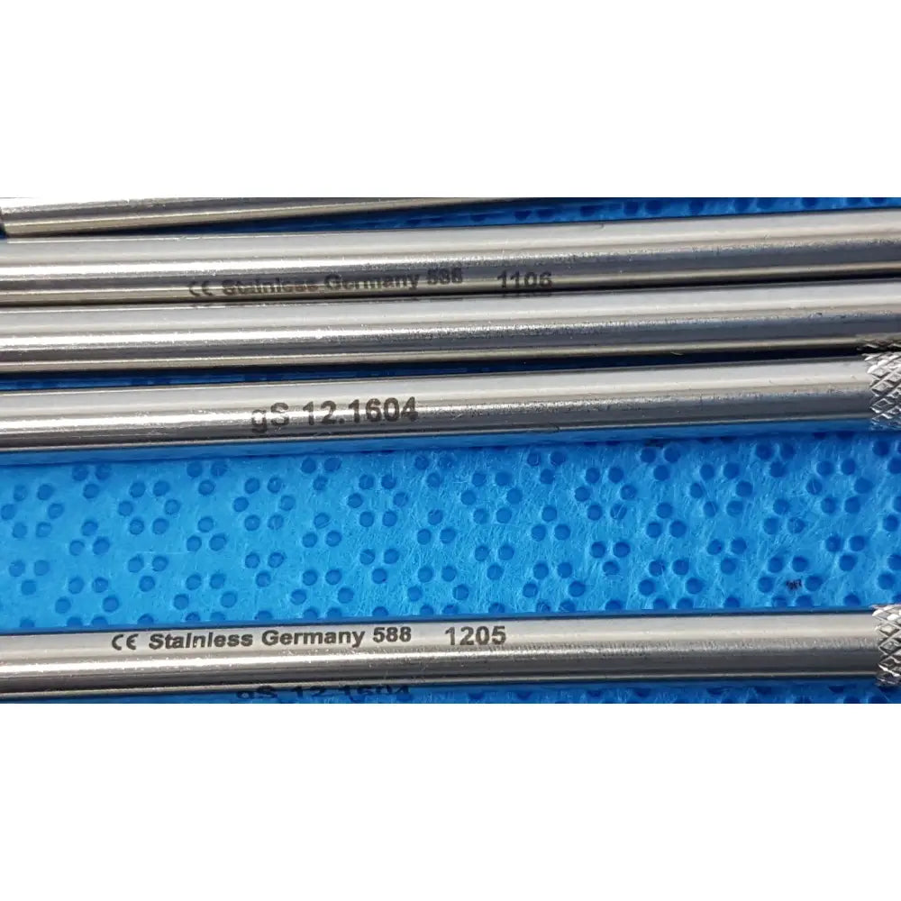 Silver german stainless steel surgical scalpel handle rods with engraved markings on blue textured surface lot of 6
