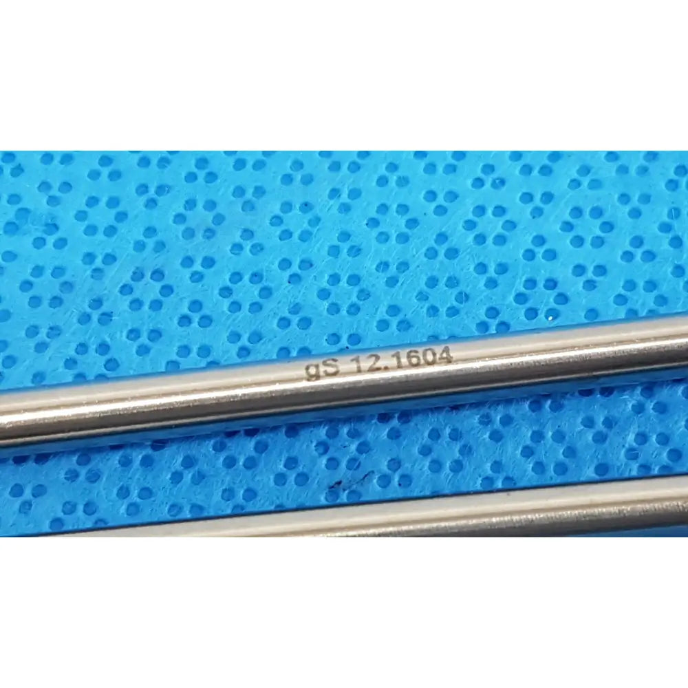A sleek metallic german stainless steel surgical scalpel handle with engraved gs 12.1604 for precision use