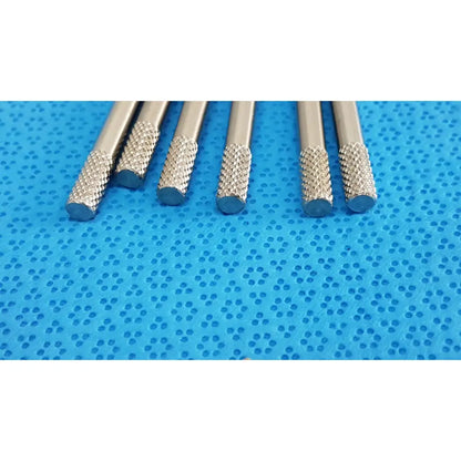 Set of five silver-colored german stainless steel surgical scalpel drill bits with diamond-patterned tips for precision use