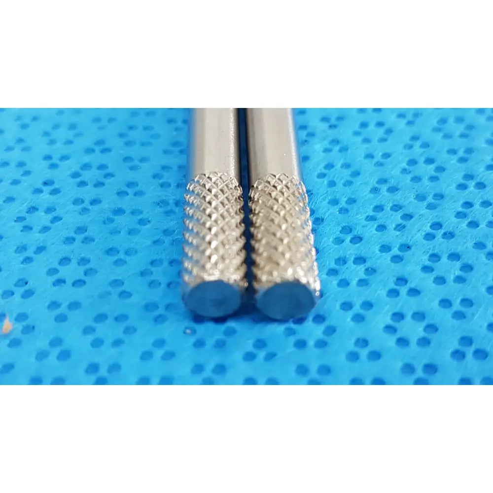 Two silver german stainless steel surgical scalpel handles with diamond-patterned blue-tipped drill bits gS12.1604