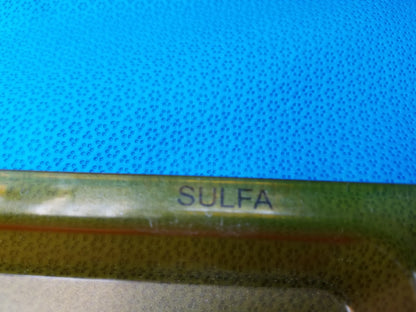 Green plastic tube labeled sulfa used with gse eyecon 9400 pharmacy optical pill counter for optical counting tasks