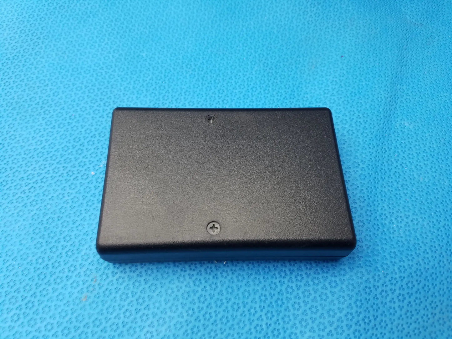 Black rectangular plastic case with two screws on back side of gse eyecon 9400 pharmacy optical pill counter for optical counting