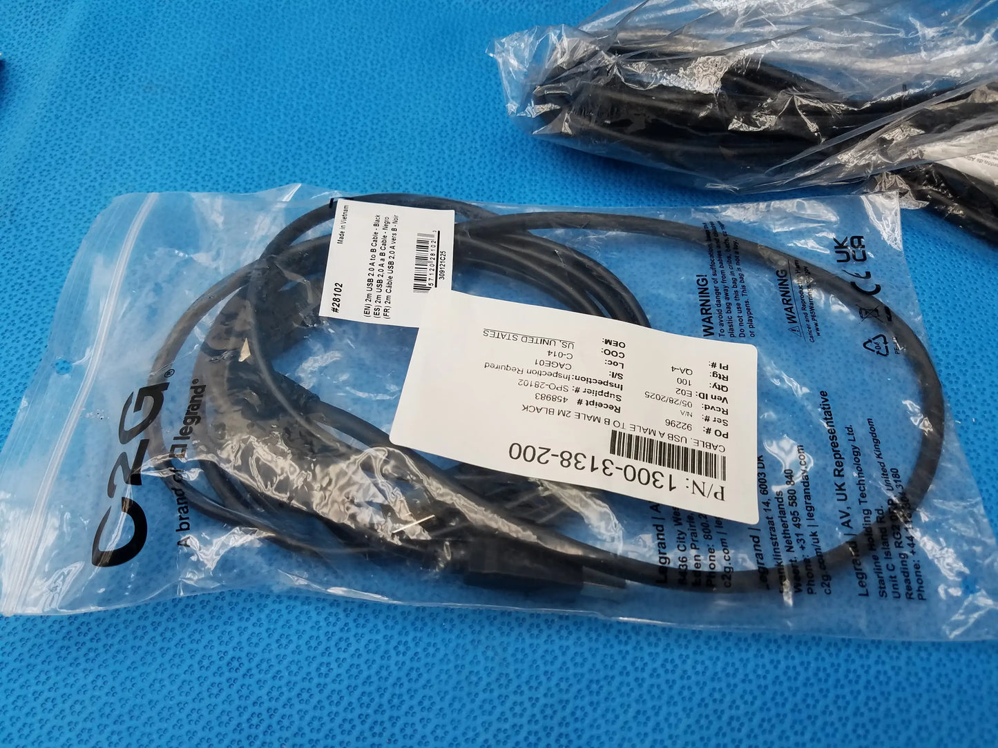 Black coiled power cable in clear plastic bag with labeling for GSE Eyecon 9400 pharmacy optical pill counter use