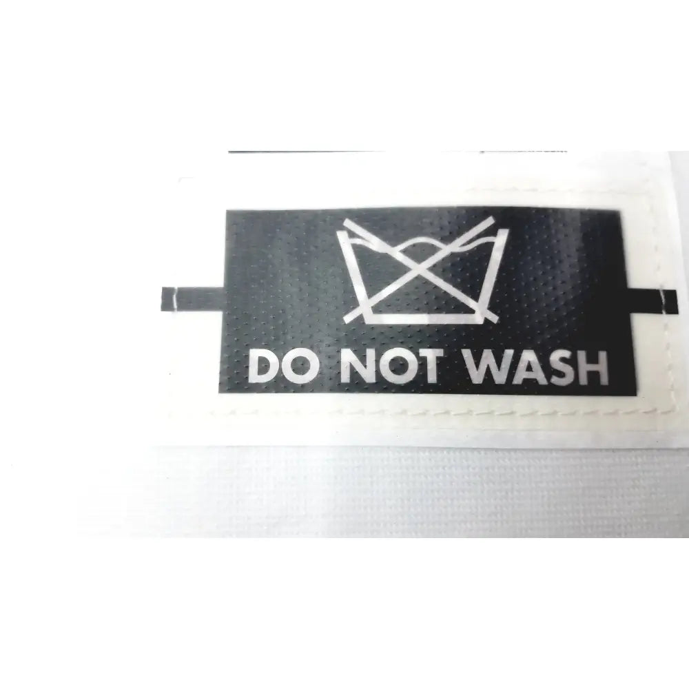 Black rectangular garment care label with do not wash symbol on the gait trainer max by guldmann disposable gait