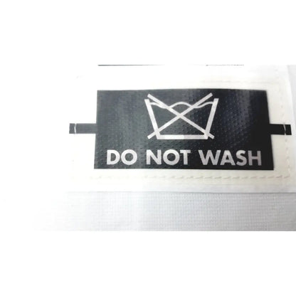 Black rectangular garment care label with do not wash symbol on the gait trainer max by guldmann disposable gait