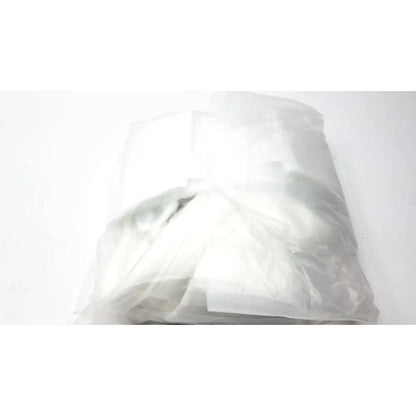 A crumpled translucent plastic bag containing a white garment for guldmann disposable gait trainer max 205 kg size large