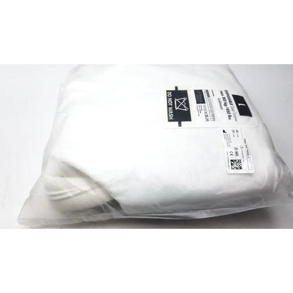 White disposable surgical gown in clear packaging with care label and qr code for guldmann disposable gait trainer max 205 kg