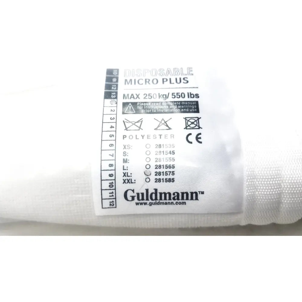 White polyester guldmann disposable micro plus cushion with black printed label showing size xl and max 250kg capacity