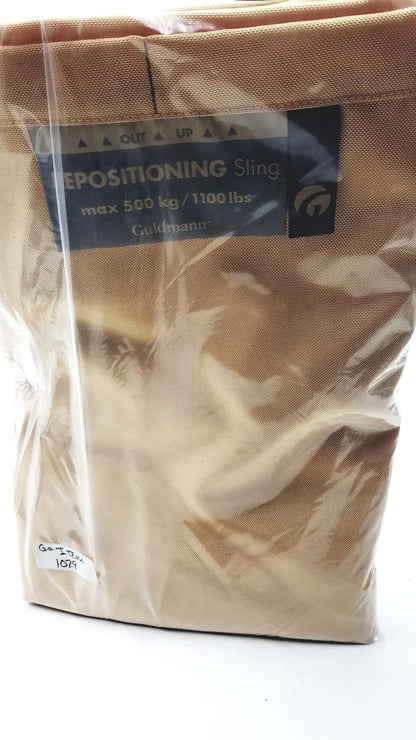 Tan fabric guldmann repositioning sling max 500 kg in clear plastic packaging supporting up to 1100 lbs capacity