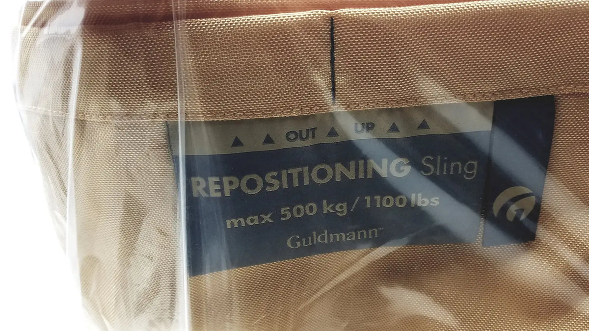 Tan fabric guldmann repositioning sling max 500 kg designed for safe patient transfer and repositioning