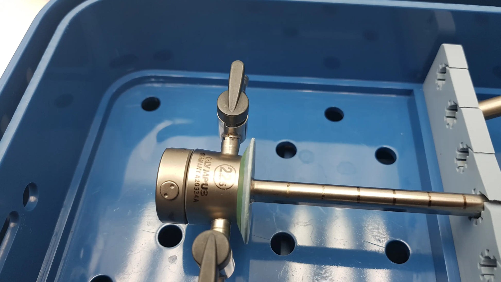 Gyrus acmi metallic surgical instrument with knurled handle and engraved markings from endoscopic instrument set