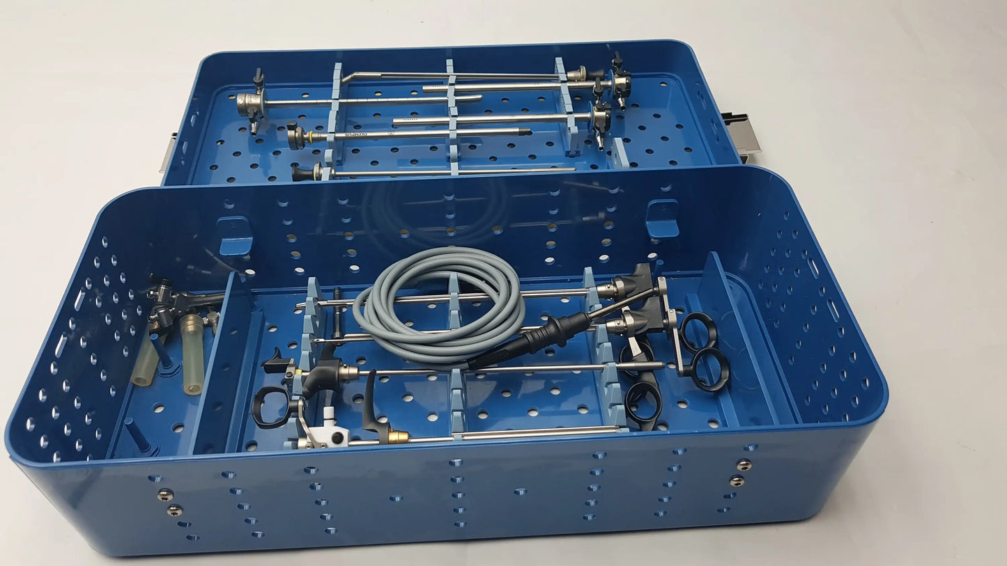 Blue surgical instrument tray with organized surgical instrument set and coiled gray cable for GYRUS ACMI endoscopic use