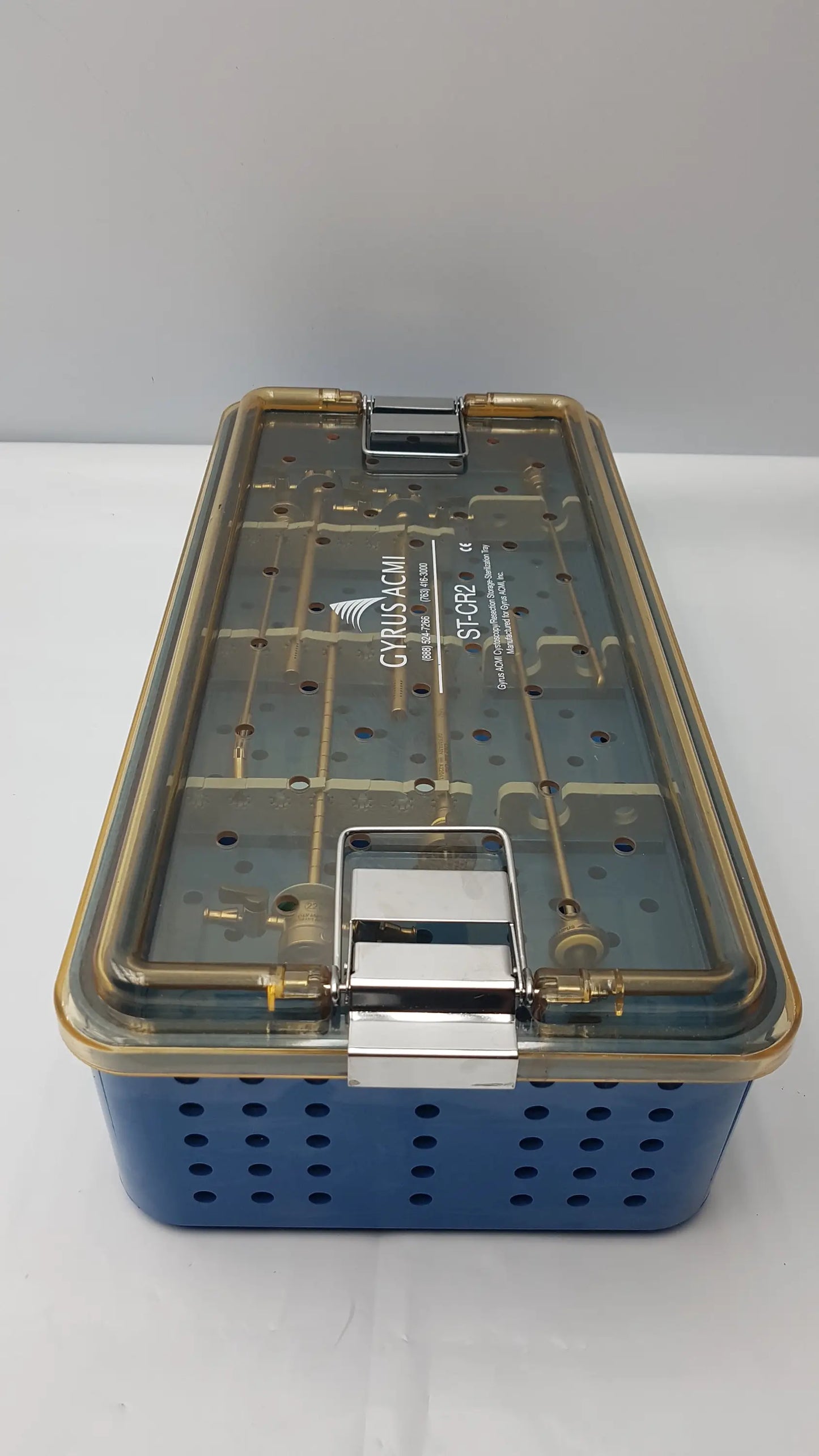 Blue perforated cyrus-acm surgical instrument set case with transparent lid and metallic clasp for endoscopic use