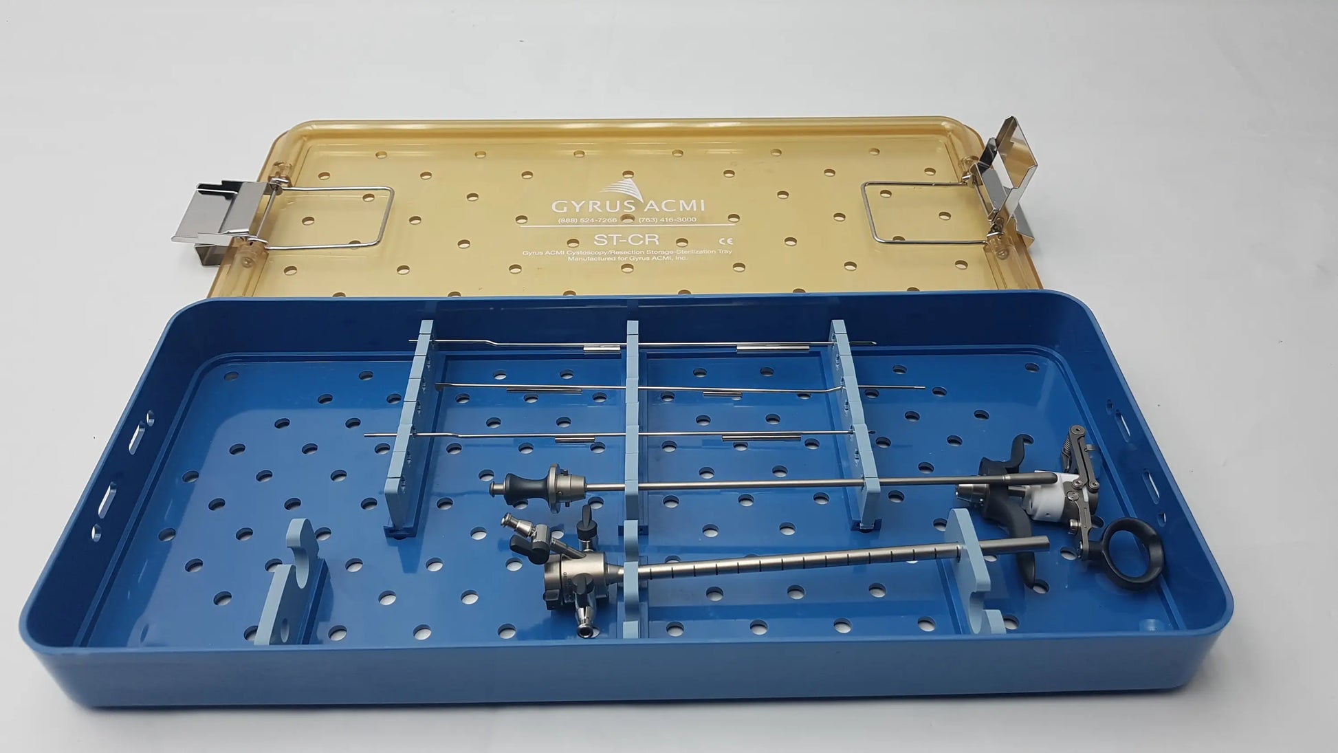 Blue and gold metal endoscope sterilization tray with organized olympus a3551 urethrotome and a3551 urethrotome sheath