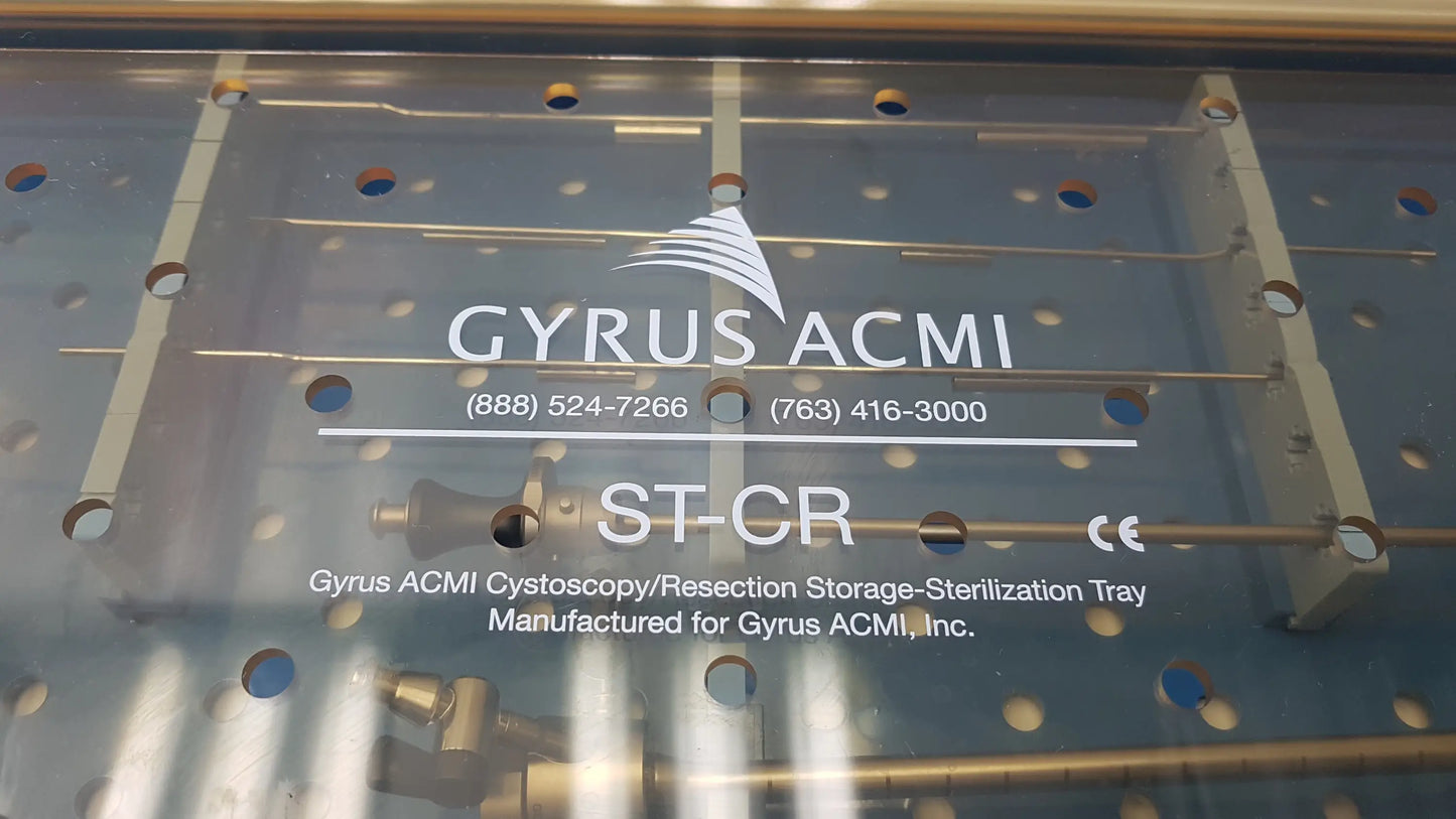 Clear plastic endoscope sterilization tray with metal components labeled gyrus acmi st-cr featuring olympus a3551 urethrotome sheath