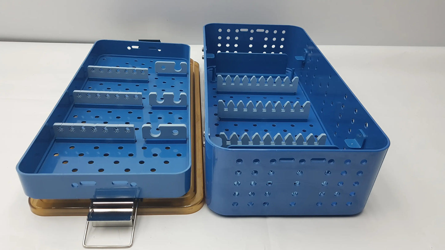 Blue plastic gyrus acmi endoscope storage tray with perforated sides and internal compartments for sterilization