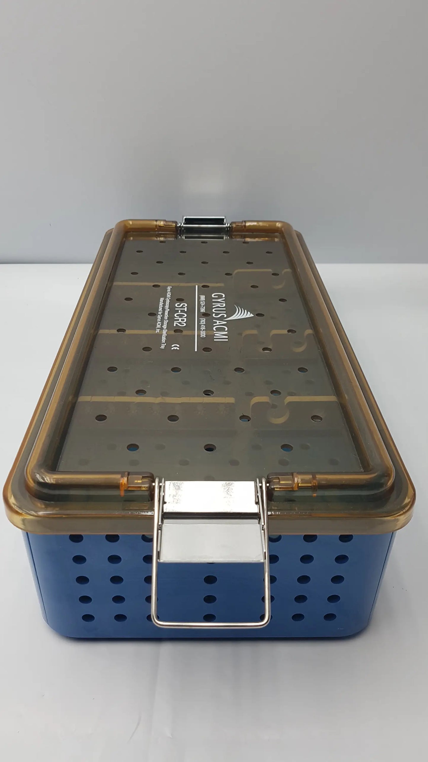 Blue perforated gyrus acmi endoscope storage tray with transparent lid and metallic clasp for sterilization