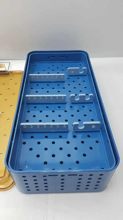 Blue plastic gyrus acmi endoscope storage tray with perforated sides and three metal dividers for sterilization use